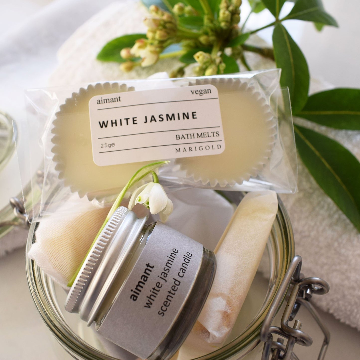 Marigold Charms Vegan Spa in a Jar Gift Collection open jar with candle and bath melts