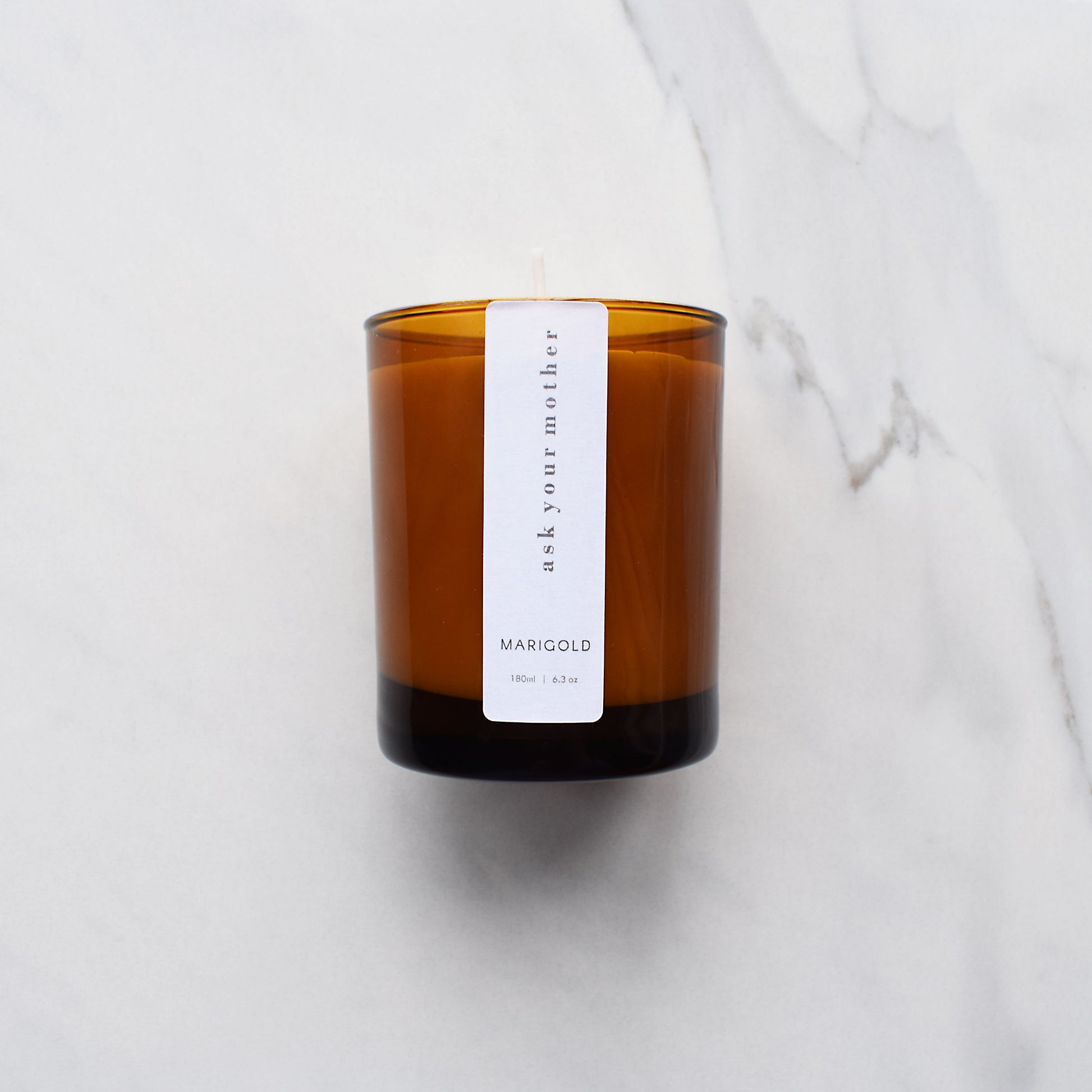 Ask Your Mother Scented Sandalwood and Bergamot Eco Soy Wax Candle on marble