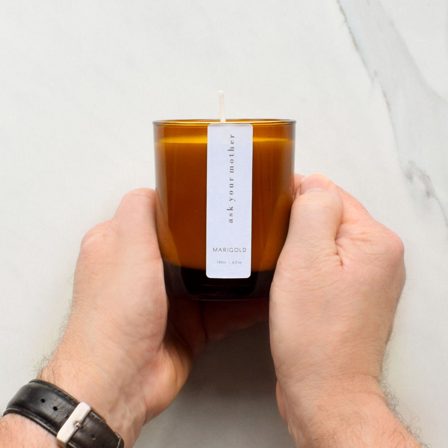 Ask Your Mother Scented Eco Soy Wax Candle held
