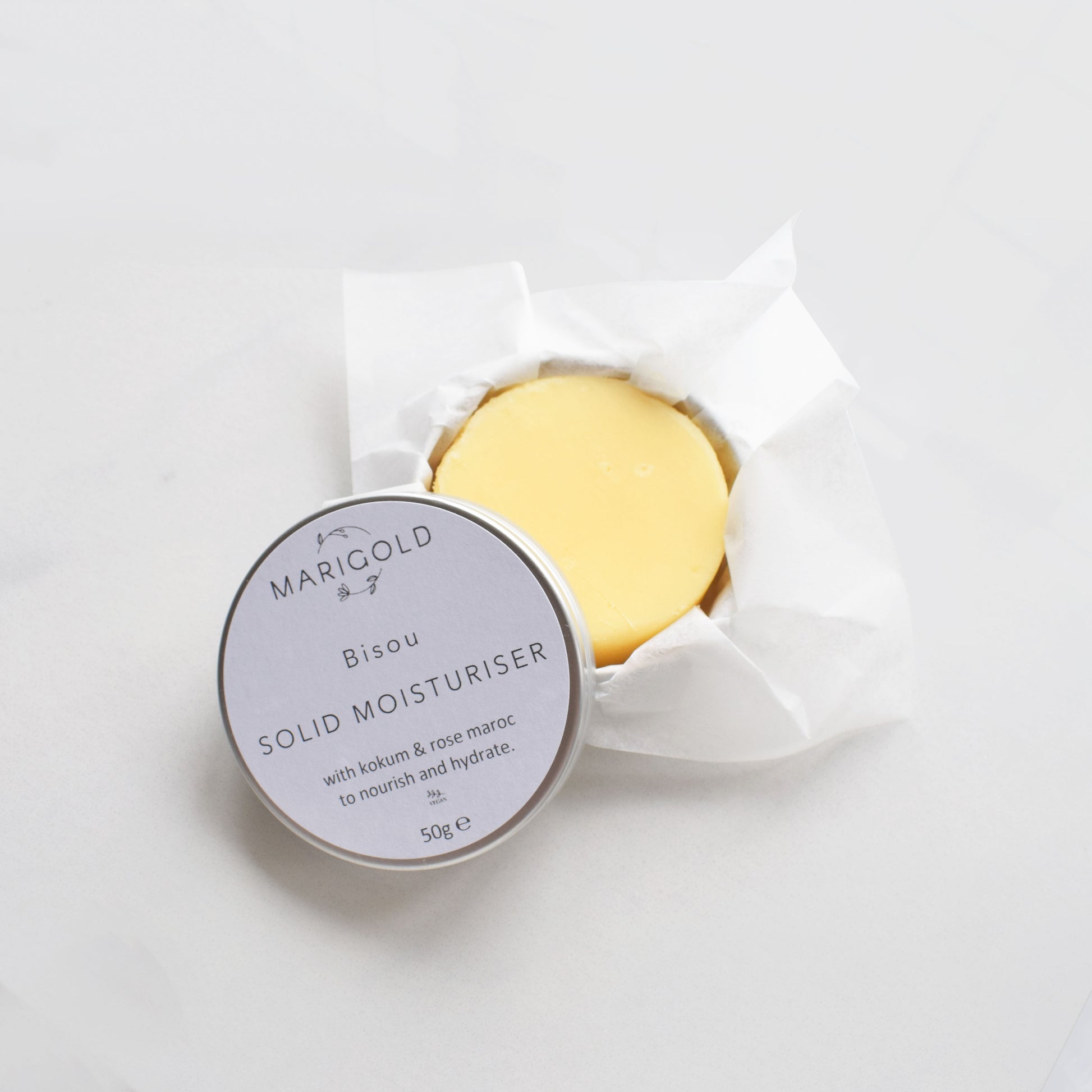 Marigold Charms Jasmine Vegan Solid Moisturiser Bar in a tin open tin unwrapped