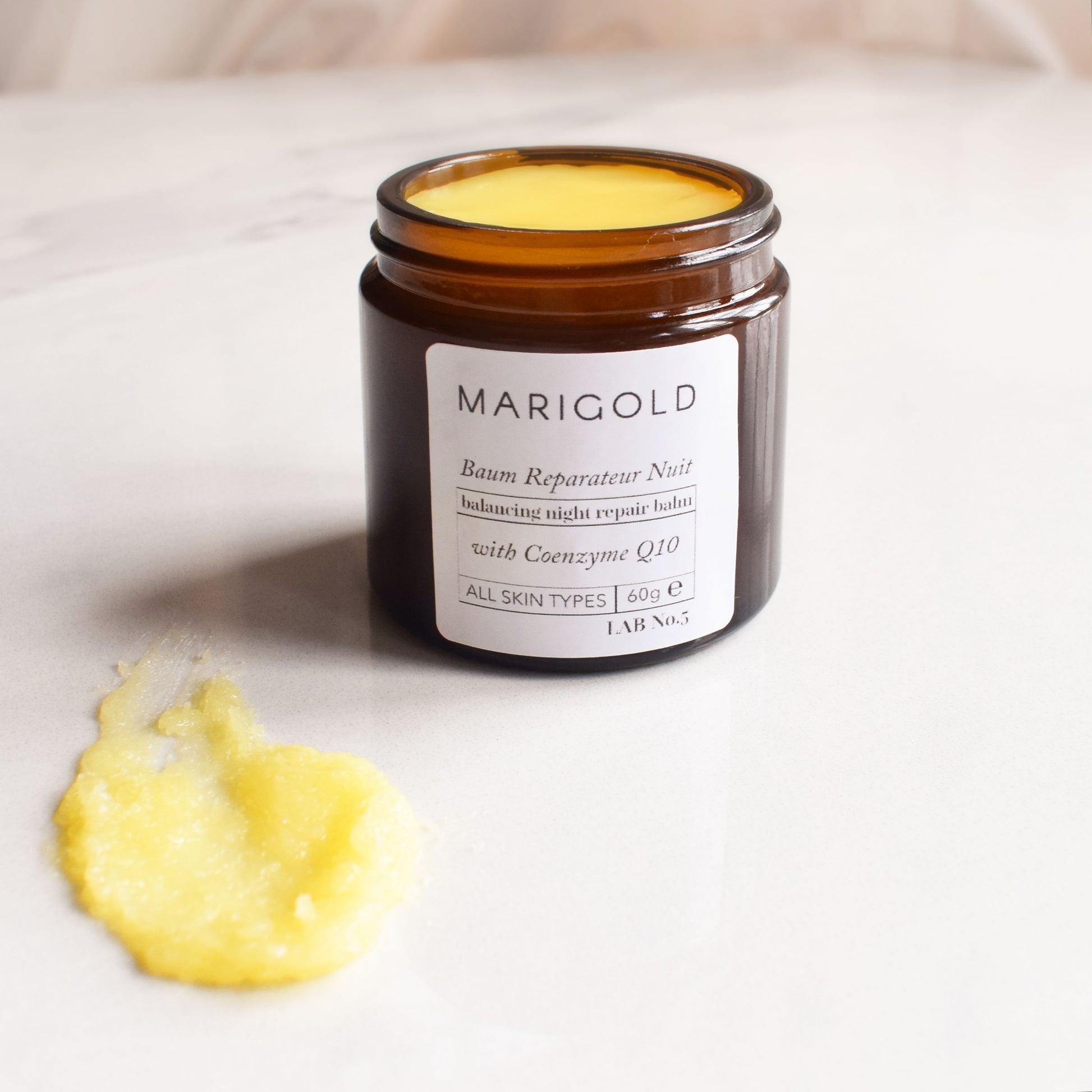 Balancing Night Repair Balm with balm on surface