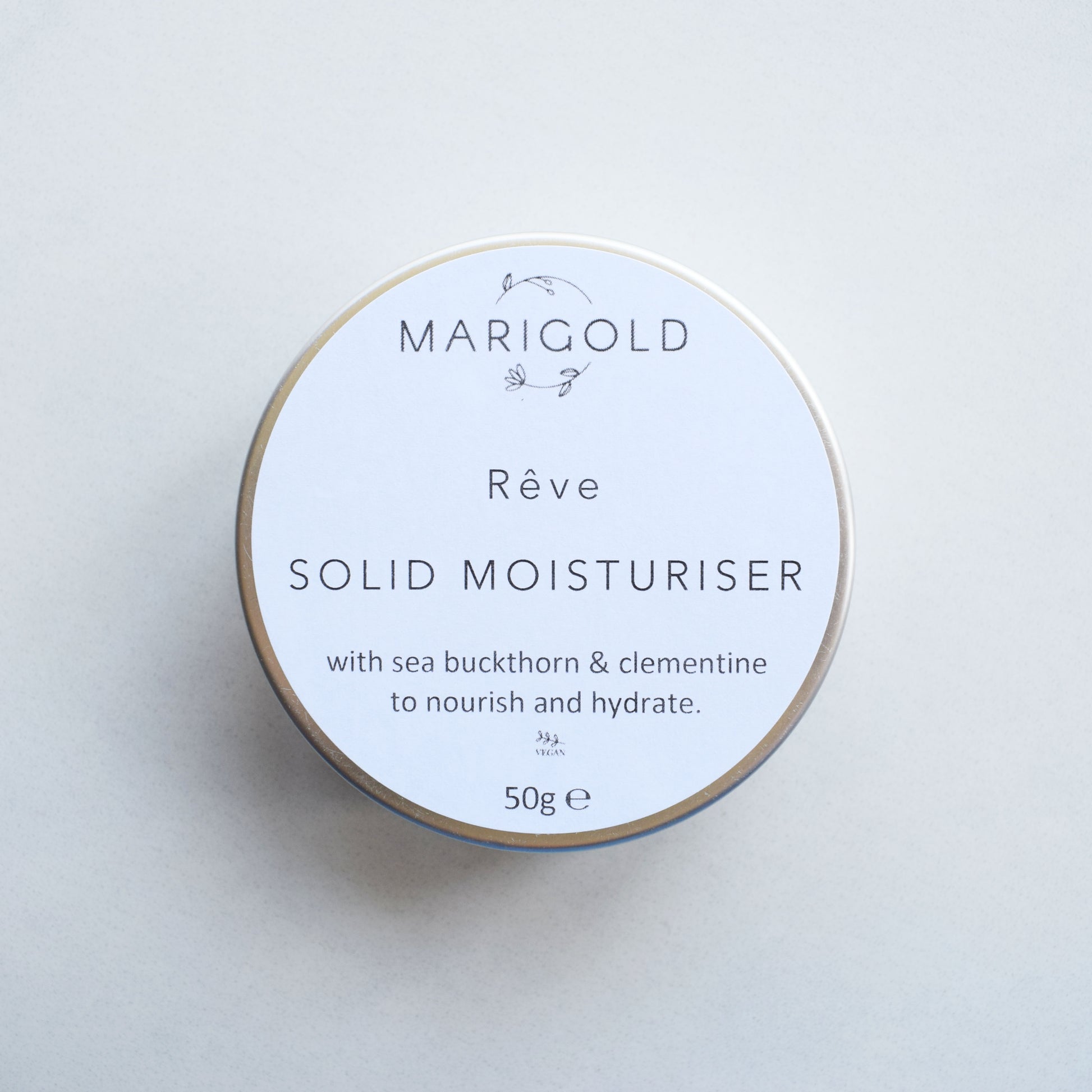 Marigold Charms Sweet Clementine Vegan Solid Moisturiser Bar in a tin