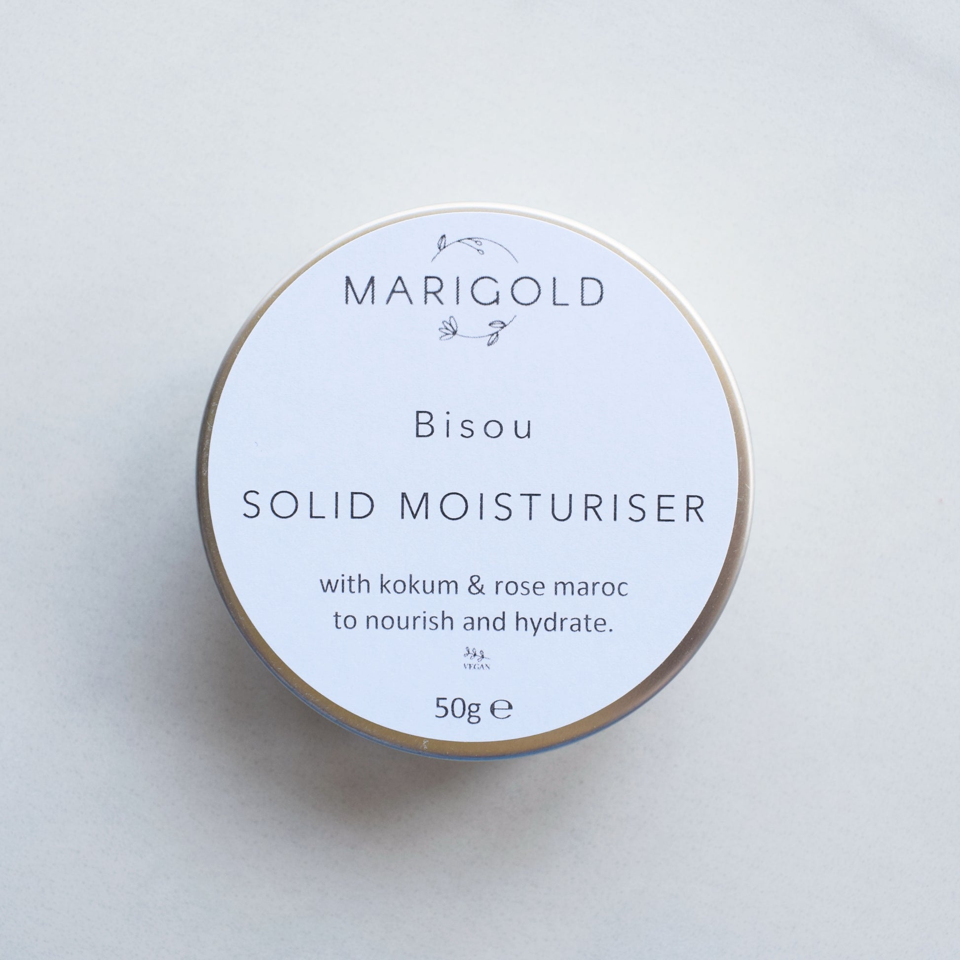 Marigold Charms Rose Maroc Vegan Solid Moisturiser Bar in a tin