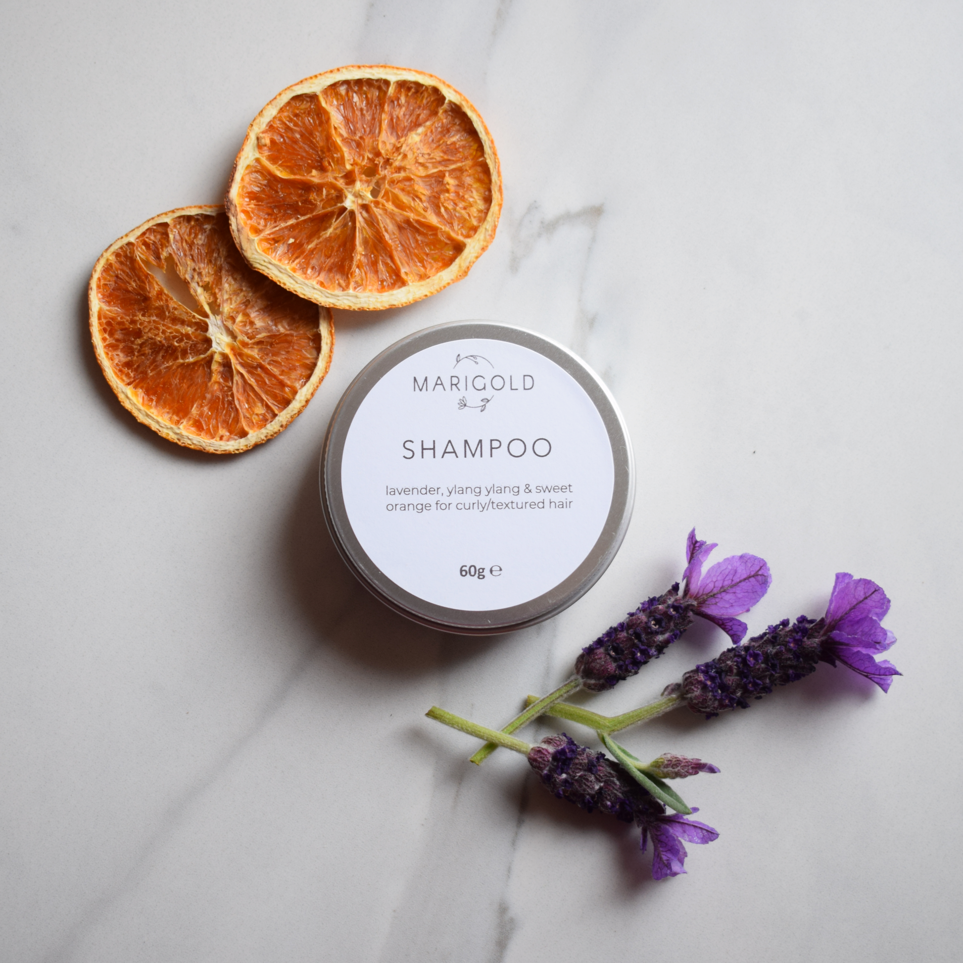 Lavender, Ylang Ylang and Sweet Orange Solid Shampoo Bar in a closed tin