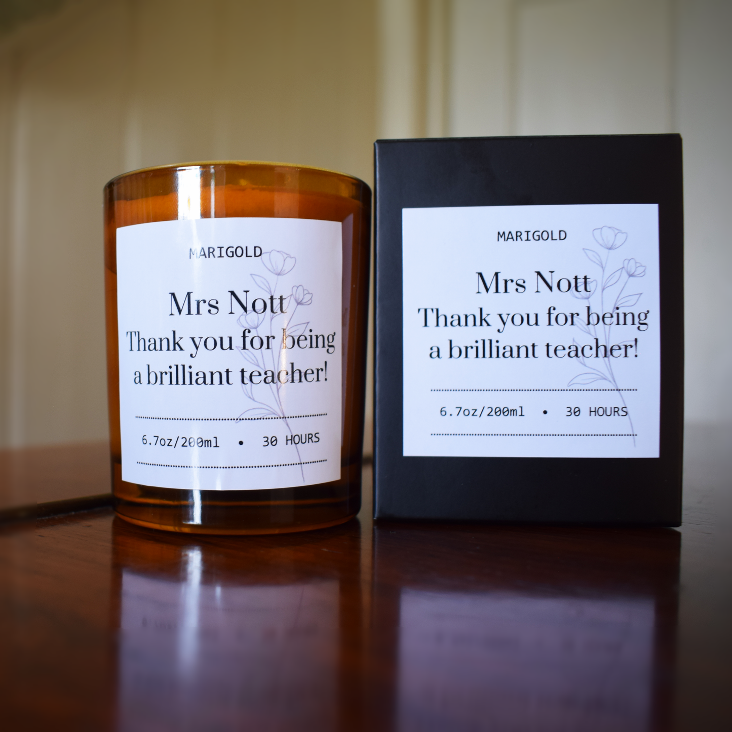 Personalised Thank you Teacher Candle and packaging  on a wooden surface